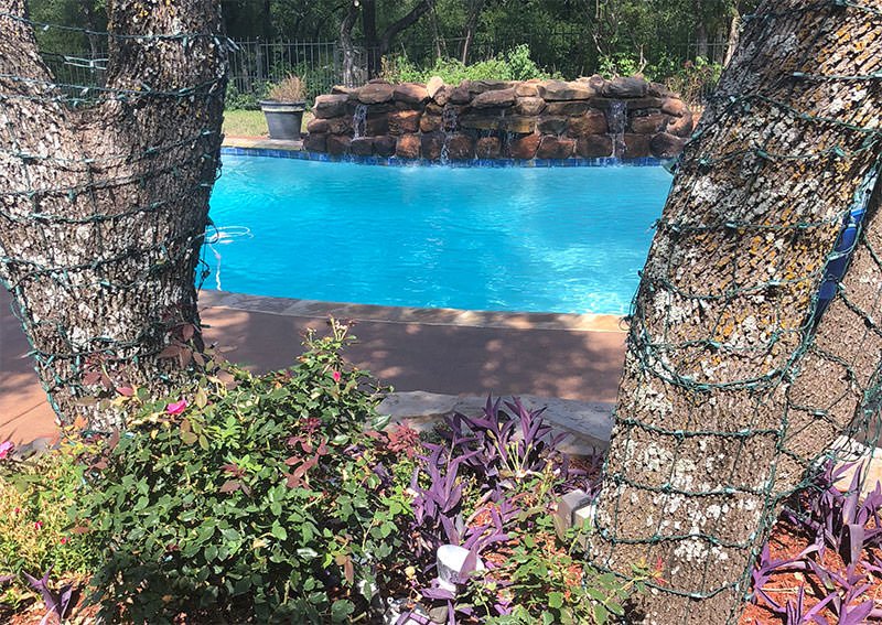 Swimming pool with waterfall