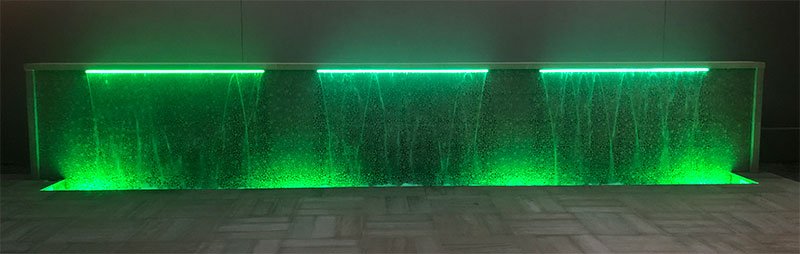 Green LED light on custom waterfall built by Willsha Pools